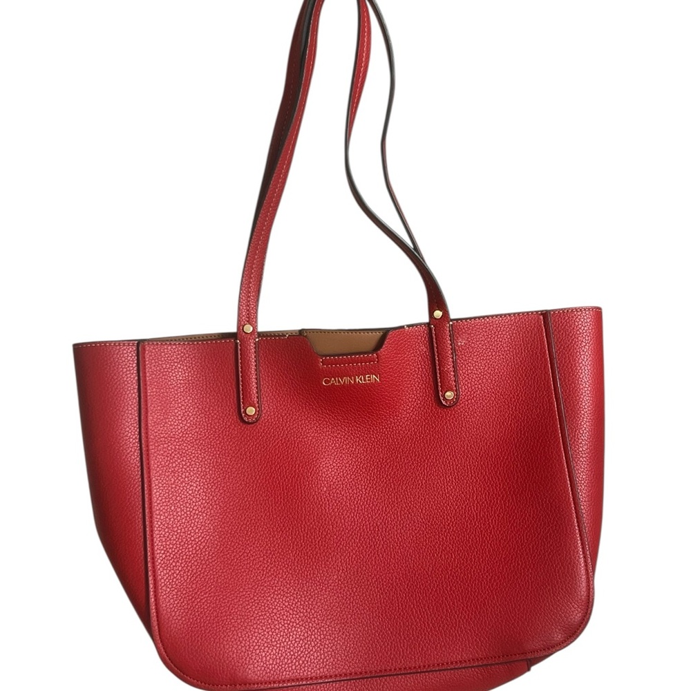Calvin Klein Vibrant Red Tote
15” long x 11” tall, excluding handles